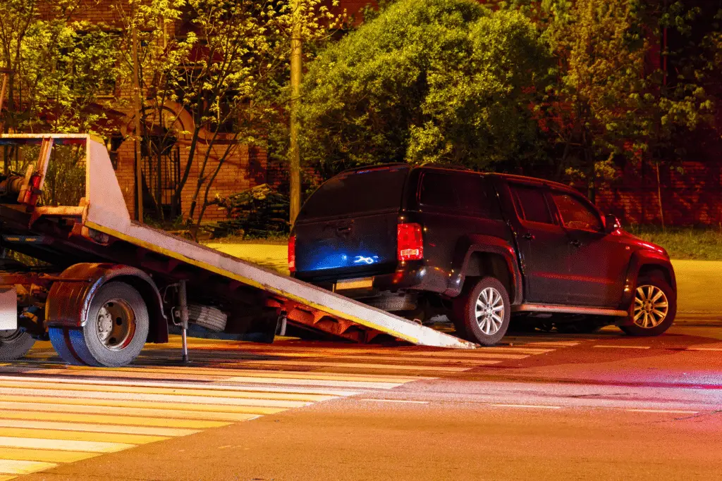 Houston car accident victim having his car towed after a collision.