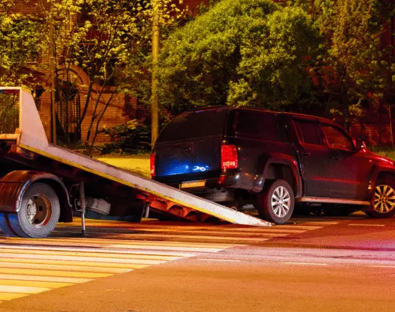 Houston car accident victim having his car towed after a collision.