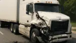 Damaged 18-wheeler truck after a collision on a Houston highway