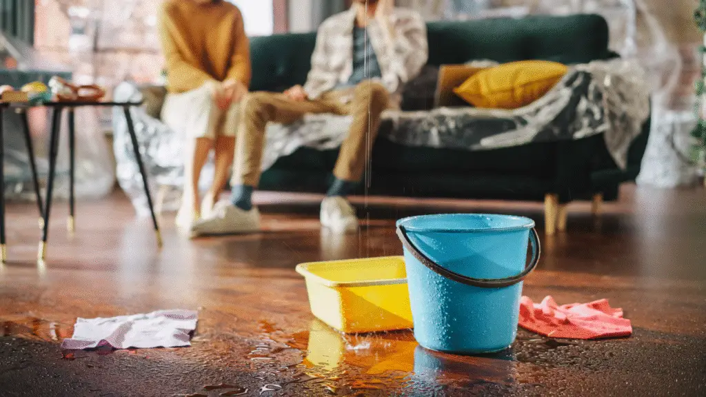 Buckets catching water from a ceiling leak in a Houston home – Texas Bulldog Property Damage Case