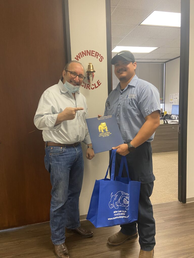 Celebration moment at The Miller Law Firm — another Bulldog client victory.