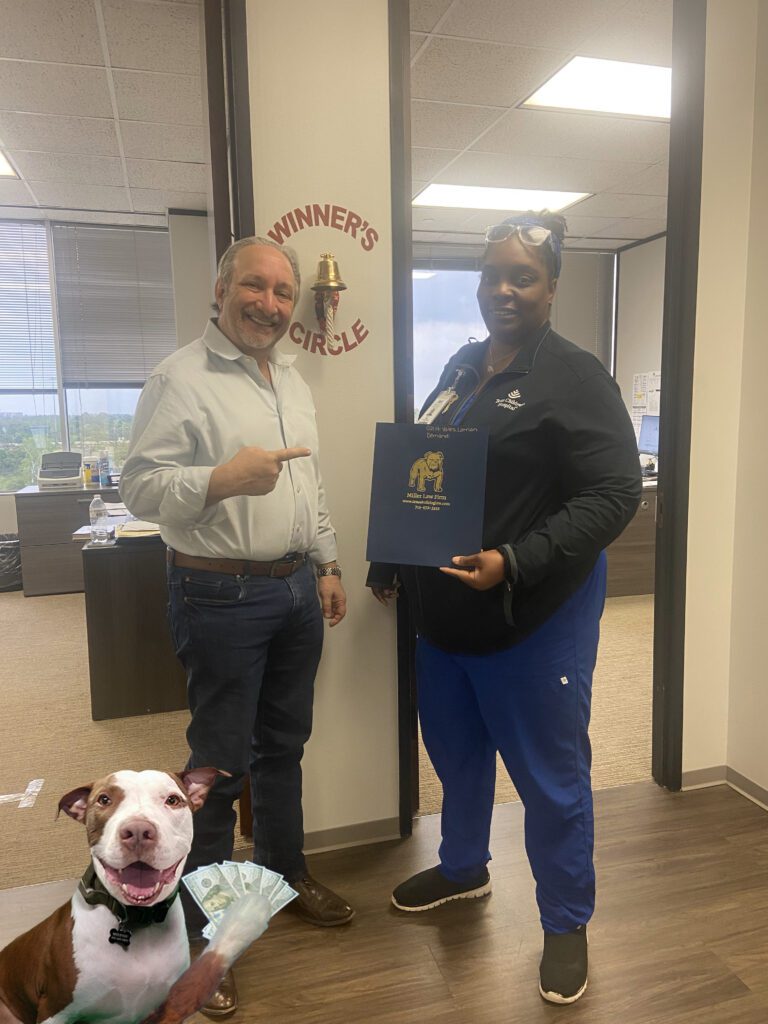 Winner’s Circle celebration at The Miller Law Firm after a successful injury case.