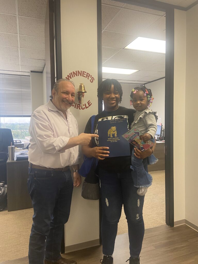Houston injury victim celebrates justice served at The Texas Bulldog Law Firm.