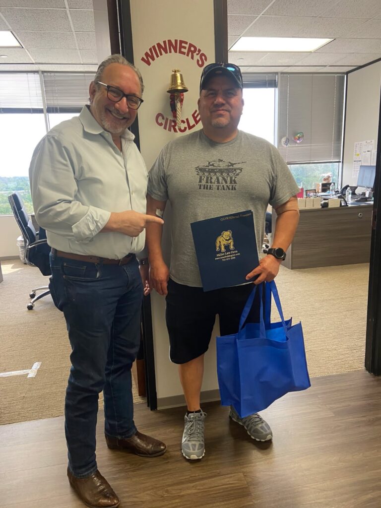 Another proud client rings the Winner’s Circle bell at The Texas Bulldog office.