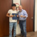 Client celebrates accident claim success with The Miller Law Firm team.