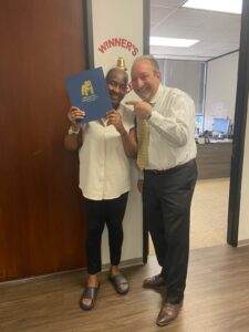 Houston injury client celebrates final settlement at The Texas Bulldog’s office.