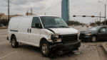 Houston van accident scene on city street with damaged white van and car — used for The Miller Law Firm, The Texas Bulldog