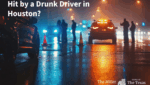 Nighttime Houston freeway crash scene with police lights after drunk driver collision