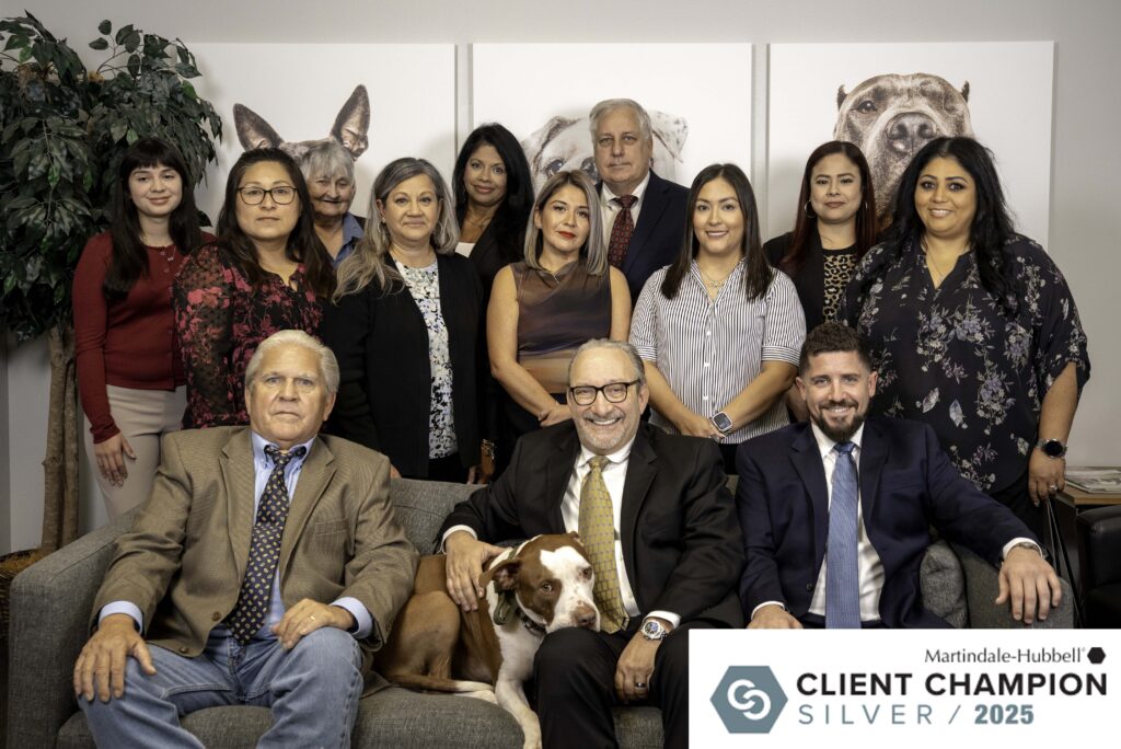 The Miller Law Firm team in Houston with Attorney Adam Miller and McLovin, featured with the Martindale-Hubbell Client Champion Silver Award 2025.