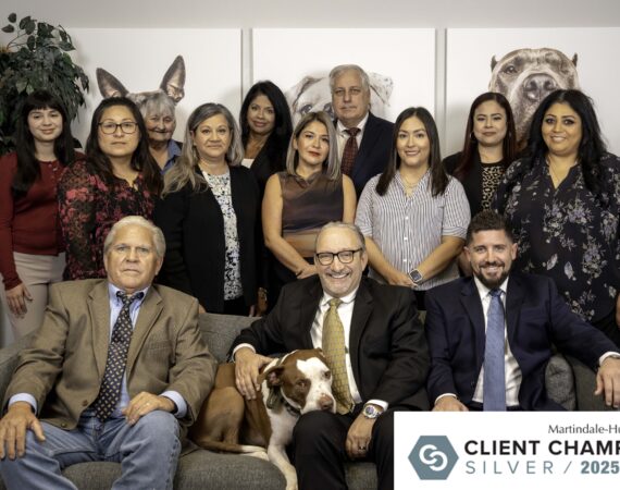 The Miller Law Firm team in Houston with Attorney Adam Miller and McLovin, featured with the Martindale-Hubbell Client Champion Silver Award 2025.