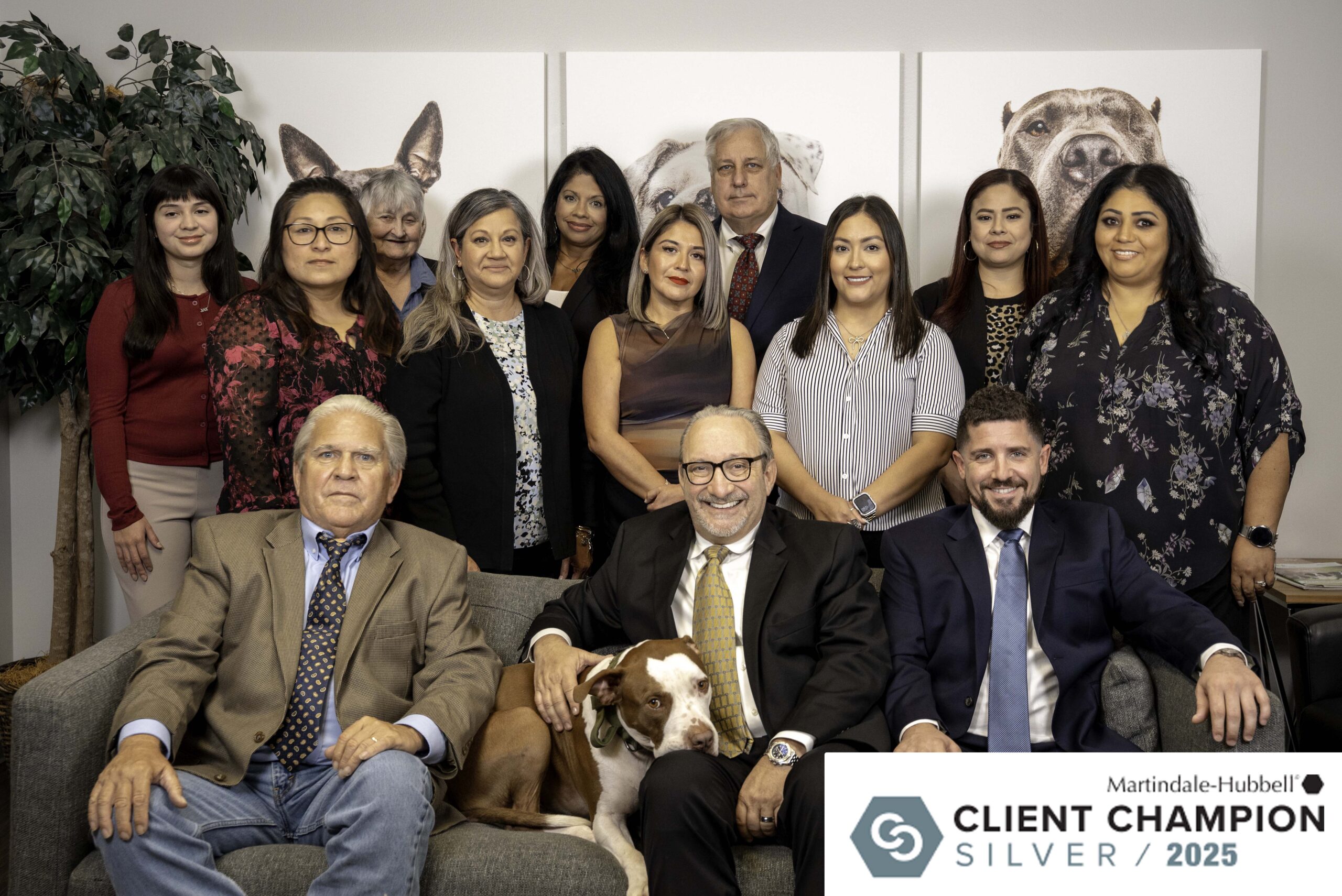 The Miller Law Firm team in Houston with Attorney Adam Miller and McLovin, featured with the Martindale-Hubbell Client Champion Silver Award 2025.